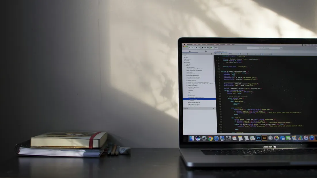 Illustrative software engineering laptop with code
